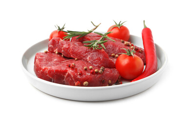 Pieces of raw beef meat, spices and tomatoes isolated on white