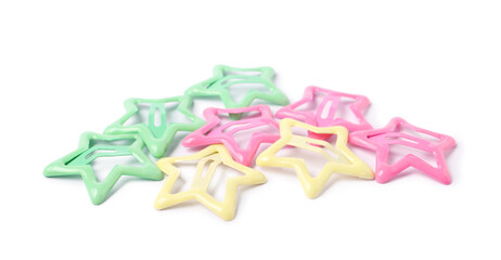 Many colorful star shaped hair clips isolated on white