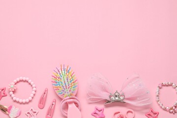Cute hair accessories on pink background, flat lay. Space for text