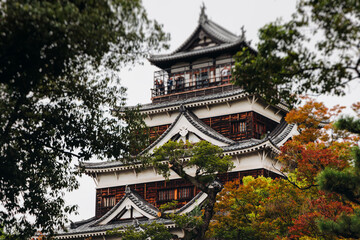 Naklejka premium Hiroshima Castle, Hiroshima city, Carp Castle, Japan, autumn fall landscape vibrant view and momiji foliage, building, Hiroshima prefecture, travel to Japan