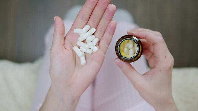 Pills and vitamins macro, Close up view of womans hands holding plenty of different drugs. Painkillers and antibiotics. Healthcare and medicine concept