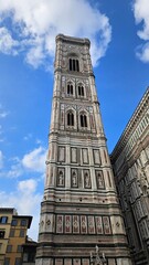 "Florence, Italy – A breathtaking view of the city’s iconic landmarks, including the Duomo and Ponte Vecchio. 