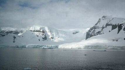 Blinding light and deep shadow are created by snow,  low clouds and sunlight in Antarctica.
