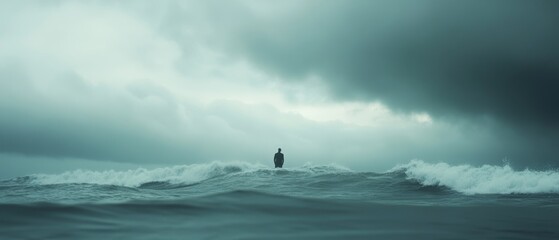 A lone figure stands resolute against crashing waves under a brooding sky, evoking feelings of solitude and determination amidst nature's fury.