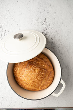 Loaf of sourdough bread in a cast iron dutch oven 