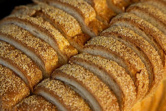 Sliced white bread with cornmeal top 