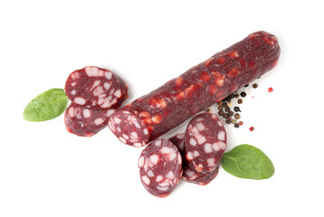 Delicious dry cured sausage and spices isolated on white, top view