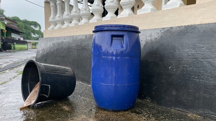 Plastic Barrels and Buckets Outdoors