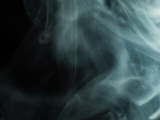 Blue wisps of smoke swirling