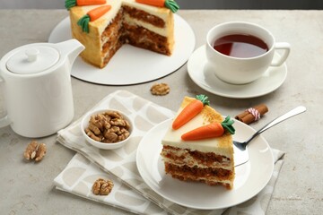 Delicious homemade carrot cake served on light grey table