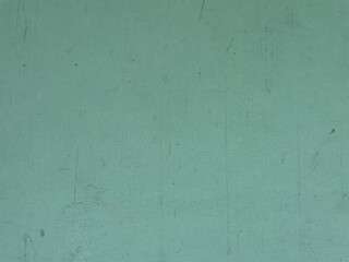 a light green flat surface that looks plain and slightly dull. The surface has some fine scratches and blemishes, indicating that it may be old or heavily used