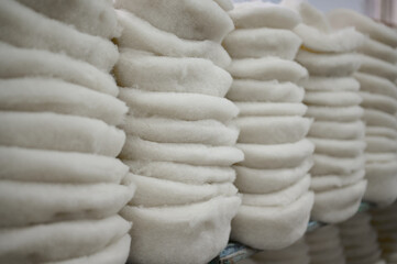 Felt factory bustling with creativity as artisans transform raw materials into beautiful, thick...