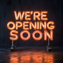 Orange neon WERE OPENING SOON sign on black