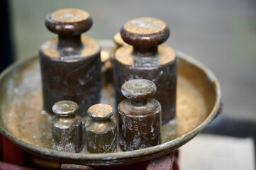 Weights and measures in a vintage balance scale showcase the artistry of precision craftsmanship from a bygone era
