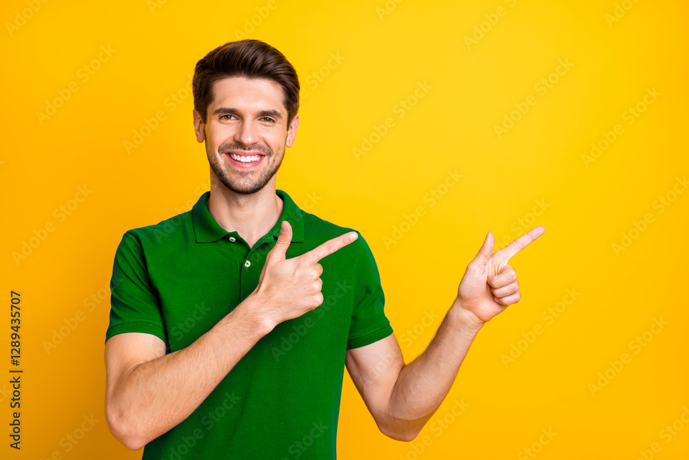 Aufkleber photo of cheerful cute nice attractive handsome man pointing at empty space to be fulfilled with his