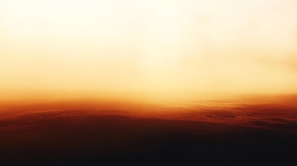 Obraz premium A hazy atmospheric image showing the sun and a fiery landscape