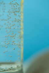 close up glass with mineral water , bubbling mineral water in a glass close-up