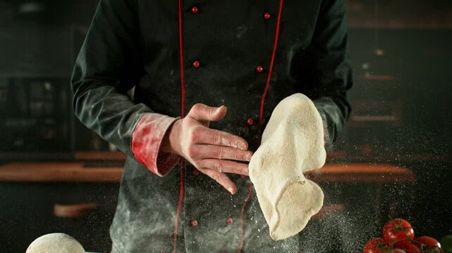 Super Slow Motion of Chef Processing Pizza Yeast Dough. Filmed on High Speed Cinema Camera, 1000 fps. Closeup of Pizza Dough Preparation.