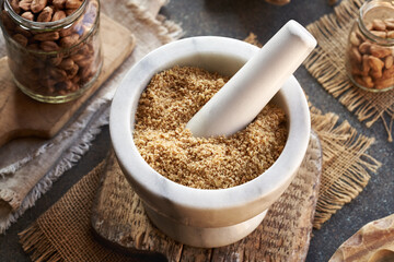 Preparation of homemade hazelnut butter from ground nuts in a mortar