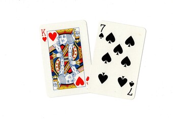 A pair of playing cards including a king of hearts on a white background.