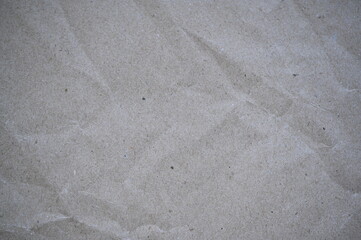 gray paper texture background for inserting text, old kraft paper as background, crumpled packing material texture as background photo above, light brown crumpled paper texture as background,	
