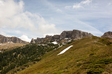early spring in the mountains, the last snow is melting in the valley