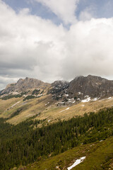 early spring in the mountains, the last snow is melting in the valley