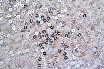 pink fabric with streaky sequins as a background, pink mesh fabric as a background 