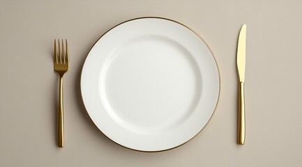 A white plate between a golden fork and knife on a soft beige surface creates an elegant setting for special gatherings
