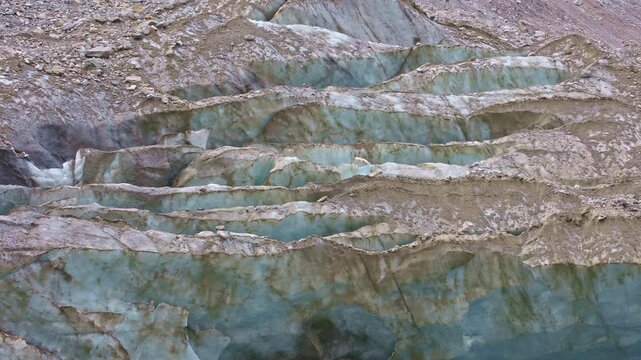 Melting glacier ice closeup. Upper Aare-Glacier, Oberaargletscher, Grimsel Pass, Canton of Berne, Switzerland.