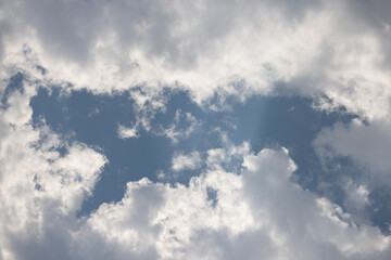 White clouds with blue sky, summer day, partly cloudy weather, clean air on a spring day