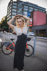 Beautiful blonde girl in the city, pinup girl, vintage style, classic beauty