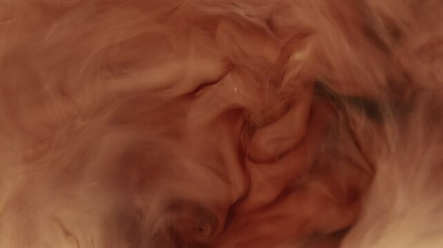 Super Slow Motion of Pouring Milk Into Coffee Drink in Extreme Close-up. Filmed on High Speed Cinema Camera, 1000 fps. Speed Ramp Effect.