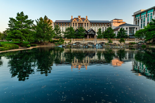 Beautiful Gaylord Texan Resort building reflected in a pond calm water