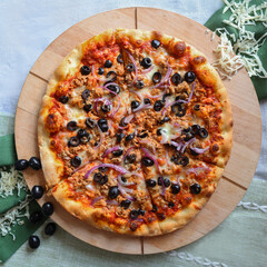 top view of pizza with tuna, olive, cheese, tomatoes, copy space, moc up