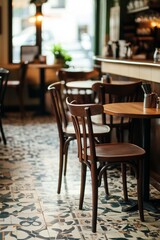 Warm, inviting caf? seating area with wooden chairs and patterned floor, creating a charming atmosphere for relaxation and conversation.