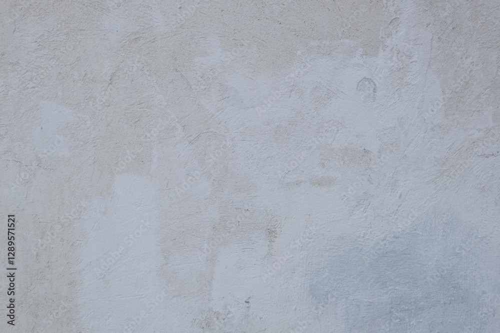 Poster a fire hydrant sits in front of a plain white wall, providing a simple and clean visual.