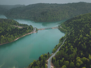 bridge over a mountain lake, a clear lake among the forest, aerial view