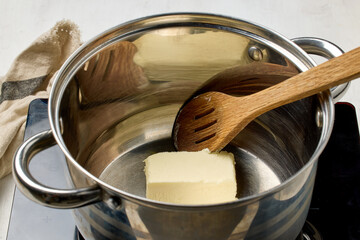 butter is being melted in a pot