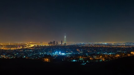 Obraz premium Breathtaking night view of Riyadh's skyline dominated by Kingdom Tower.