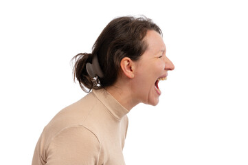 A young woman with a ponytail passionately yelling against a white background.