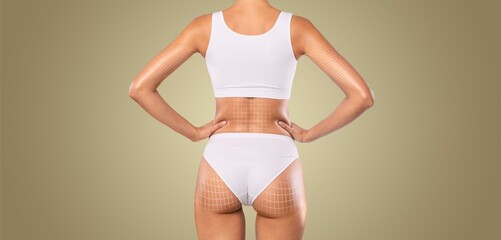 A woman stands confidently, highlighting her curves while engaging in body sculpting and contouring...