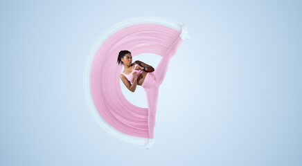 Determined African American woman in sportswear doing high kick, tae-bo martial arts exercises on blue background, full length, free space. Athletic lady with perfect body practicing kicks