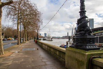 The River Thames,, boats and ships, skyscrapers and office buildings in the city skyline in Westminster England UK