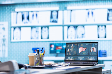 Empty medical office with computers and diagnostic tools set up for professional consultations, x...