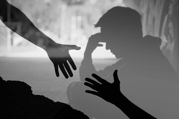 Man suffering from depression sadness needing a helping hand from a friend. 

