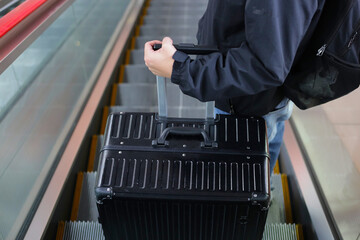 Man hand touching baggage in international airport.