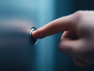 Finger Pressing a Button on a Blue Metal Surface