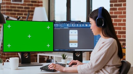 Industrial engineer works with CAD software and isolated mockup in a modern workspace at home. The...