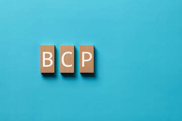 There is wood block with the word BCP. It is an abbreviation for Business Continuity Plan as...
